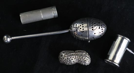 An Asprey silver box modelled as a peanut, an Edwardian silver vesta case, a silver lipstick holder and a tea infuser.